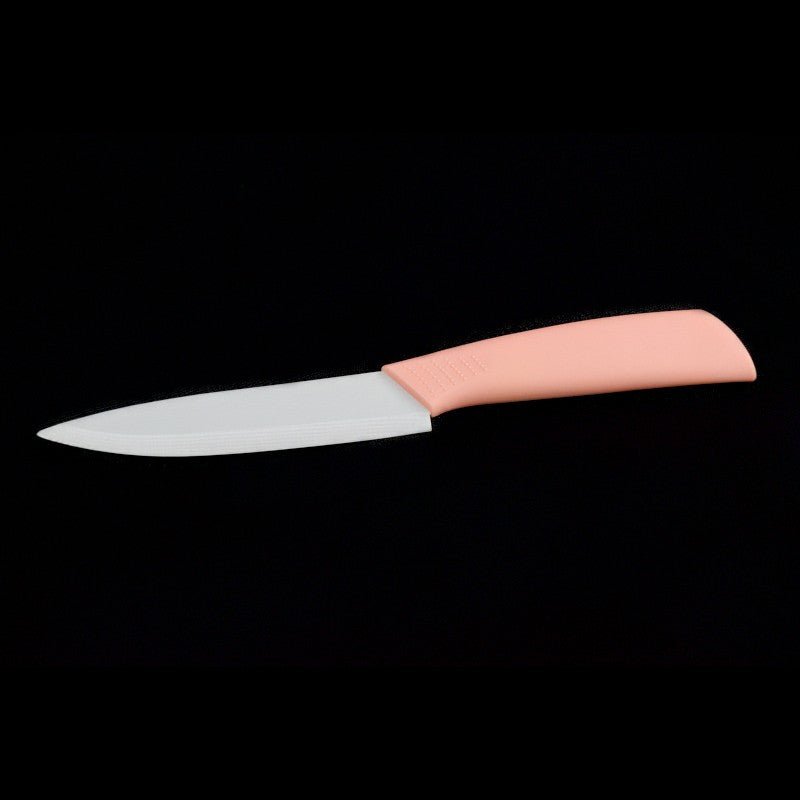 Gemüsemesser mit 10cm Klingenlänge als Keramikmesser aus Zirkonoxid mit weißer Klinge und pinkem Kunststoff - Griff