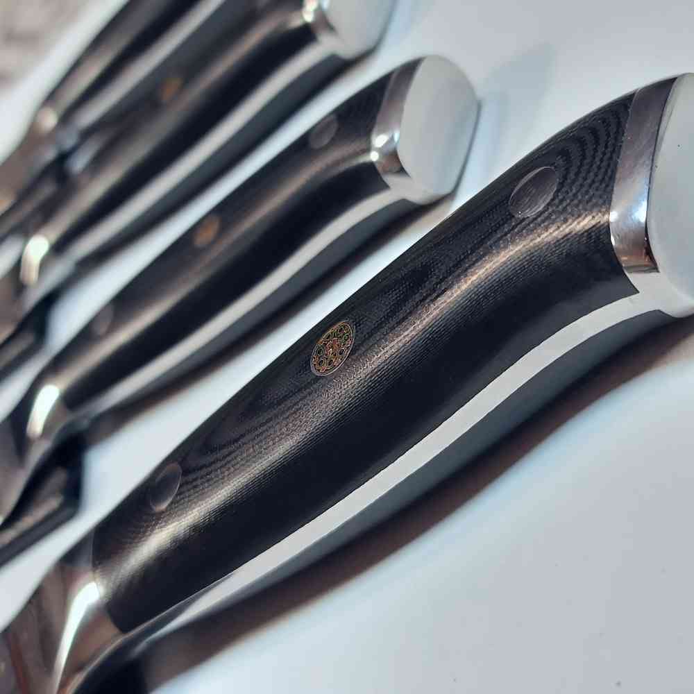 Günstiges Damast-Küchenmesser mit robustem G10-Griff – edles Schneidebesteck für die moderne Küche.
